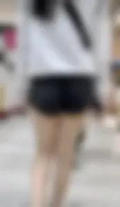 Asian girl in tight black shorts at the mall