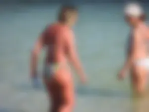 Blonde milf on the beach in her bikini