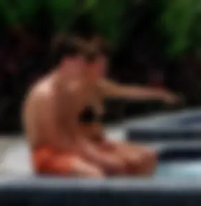 Jacuzzi girl with a nice ass in semi thong bikini and some cleavage