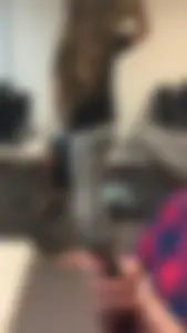 Skinny college girl in grey leggings in class
