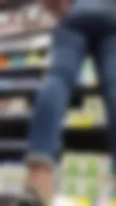 Brunette girl with nice ass sexy PAWG in tight jeans in a store