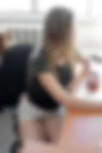 Girl in Short Skirt Sitting at the Office Desk with Lacy Transparent Panties Visible - Office Upskirt Candid