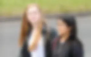 Redhead and ethnic skinny teens in tight jeans