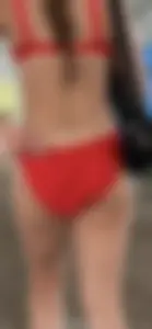 Beauty picks at her bikini wedgie