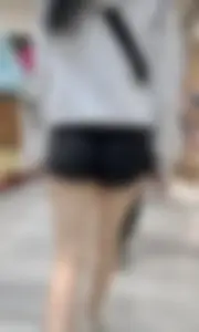 Asian girl in tight black shorts at the mall