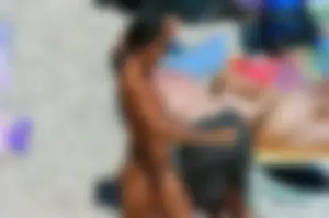 Ula FKK Sexy brunette on a nude beach topless, bottomless and with blue thong