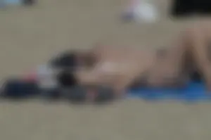 Topless girls on a beach in Barcelona