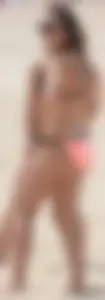 Girl in peach bikini on the beach with a great body and great ass