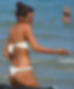 Hot girl at the beach with a nice ass in a white bikini