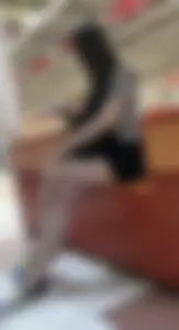 Girl with Hot Long Legs Sitting in the Mall Candid