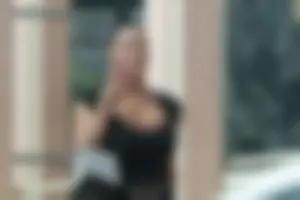 Brunette showing massive cleavage with big ass tits