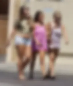 Three girls on the way to the ice cream parlor