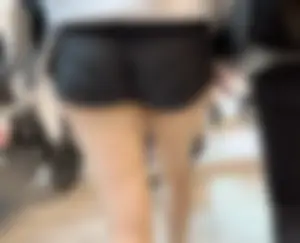 Asian girl in tight black shorts at the mall