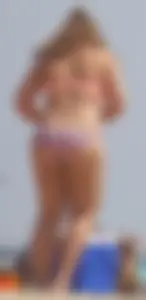 Two thick white girls in bikinis on the beach with big asses