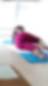 Sexy girlfriend doing yoga at home in leggings