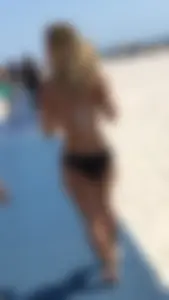 Sexy candid blonde girl with a nice ass in a black bikini