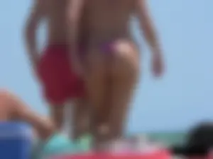 Purple thong topless lady on the beach gets oiled up by her husband