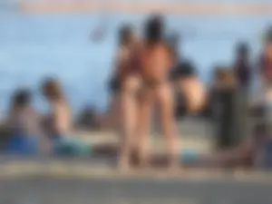 Fit girl with nice body in thong bikini on the beach