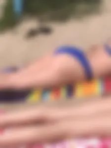 Sunbathers all oiled up and spread