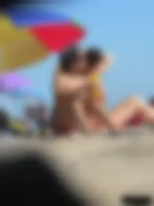 Sexy girls going topless at the beach showing off their sexy bodies