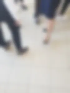 Legs of a Group of College Girls Standing in a Corridor