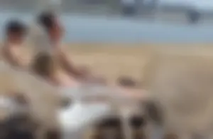 Blonde beach girl with a great ass in pink thong bikini