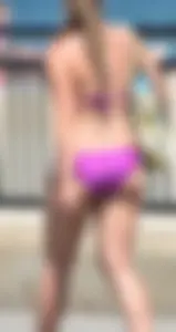 Sexy thick blonde girl in purple bikini