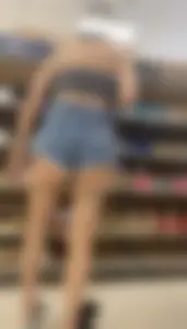 Slim Latina ass peeking out of shorts