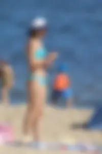 Couple of hot babes hanging out at the beach in bikinis