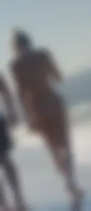 Smooth bodied and sexy blonde at the beach in a thong bikini