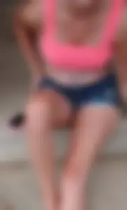 Friend in short shorts showing cheeks and some cleavage