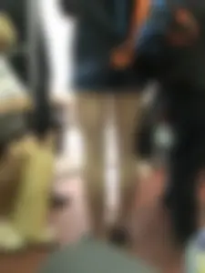 Girl in Shorts Standing in a Subway Train With Spread Legs - Creepshots Gallery