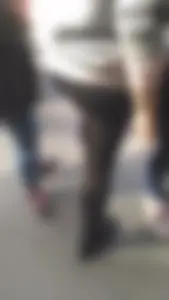 Girl wearing a black skirt over her leggings