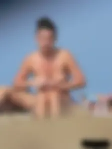 Sexy babe with a nice body topless and in a thong on the beach