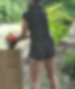 Brunette gardener in shorts bends over… and over as she works [085]