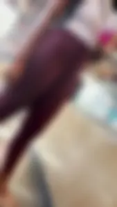 Ebony in purple leggings waiting in line
