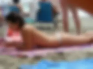 Hot topless girl on the beach in a thong bikini with a nice ass