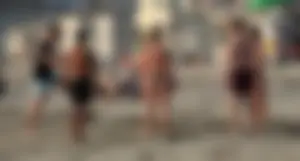 Thick white girls ass in a black thong bikini at the beach