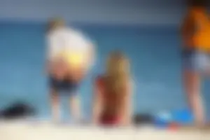 Hot blonde with a slammin body in red thong bikini on the beach
