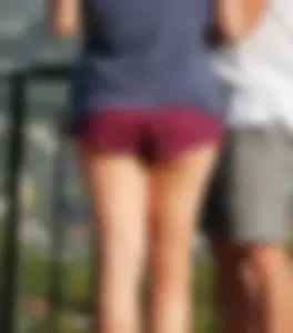 Girl in short maroon shorts with decent booty