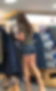 Brunette babe in denim shorts with a sexy ass and legs