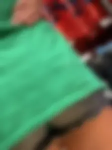 Bunch of girls in various outfits at a Cardinals baseball game