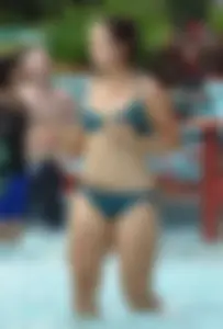 Thick brunette in a bikini while in the pool