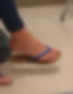 Sneaky Closeup of a Girl's Foot in a Slipper