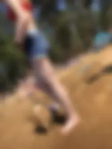 Skinny Barefoot Girl in Swimsuit and Shorts at the Beach Candid Photo Gallery