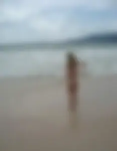 Micro thong blonde on the beach with pokies and camel toe
