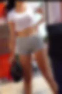 Sexy Girl in a Top and Shorts Standing With Spread Legs Street Creepshot