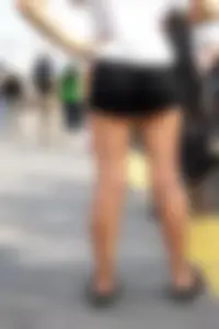 Girl with a nice ass in shorts showing a bit of cheeks