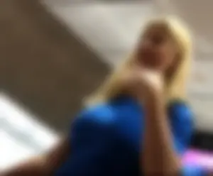 Blonde lady with big boobs showing pokies