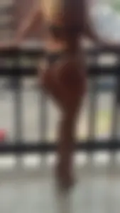 Hot Blonde Milf's Booty in a Swimsuit, Standing on a Balcony Creepshot